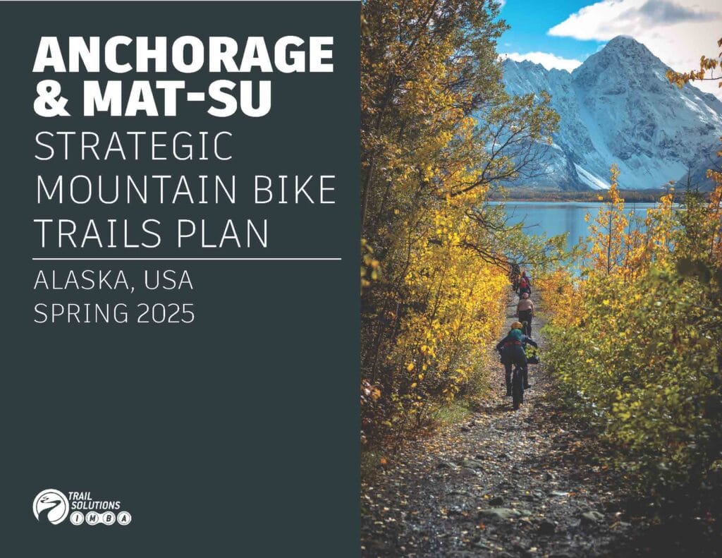Cover of the Anchorage and Mat-Su Strategic Mountain Bike Trails Plan, Spring 2025, IMBA Trail Solutions: riders on a fall trail below a snowy peak